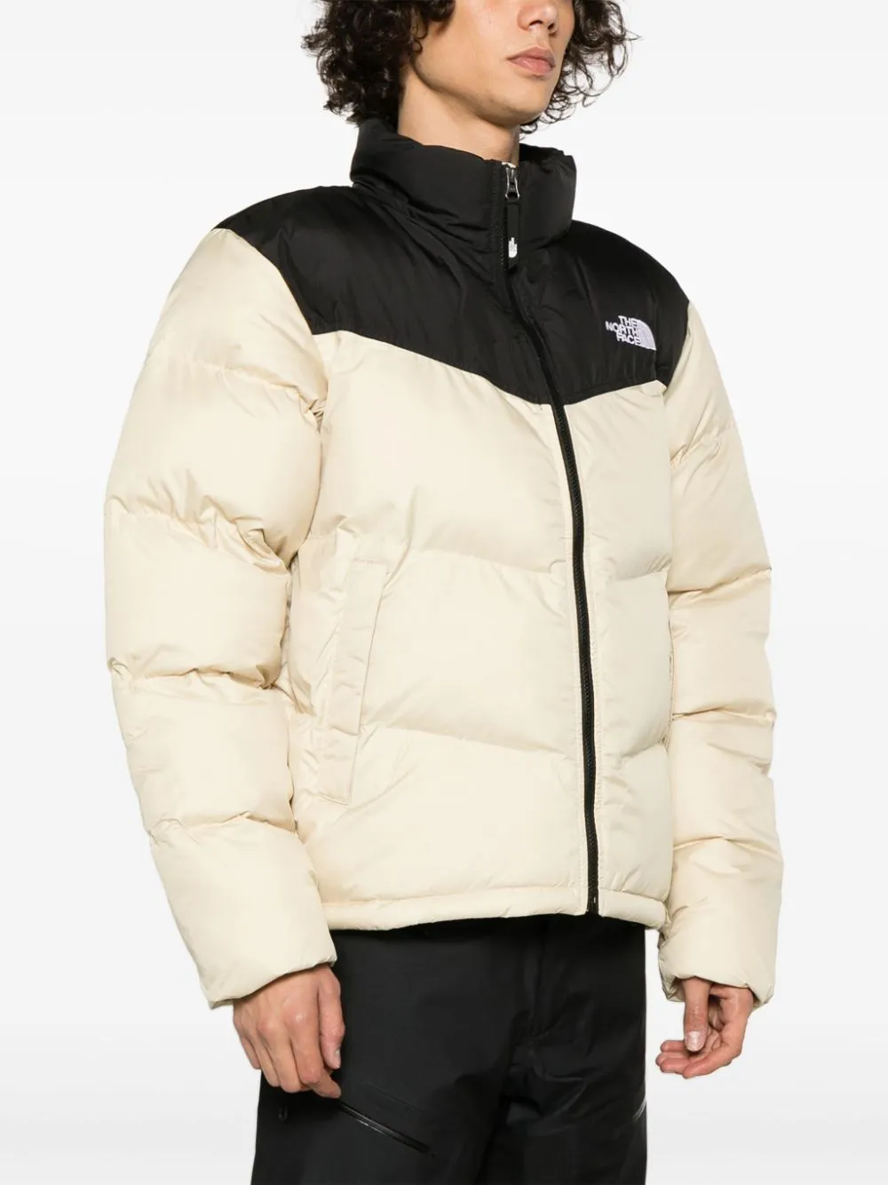 Saikuru logo-embroidered quilted jacket